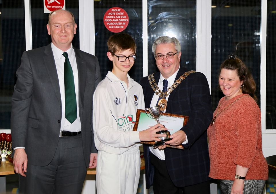 Erik Hillman collects the award for sporting commitment on behalf of the U16s